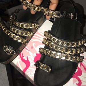 gold and black sandals